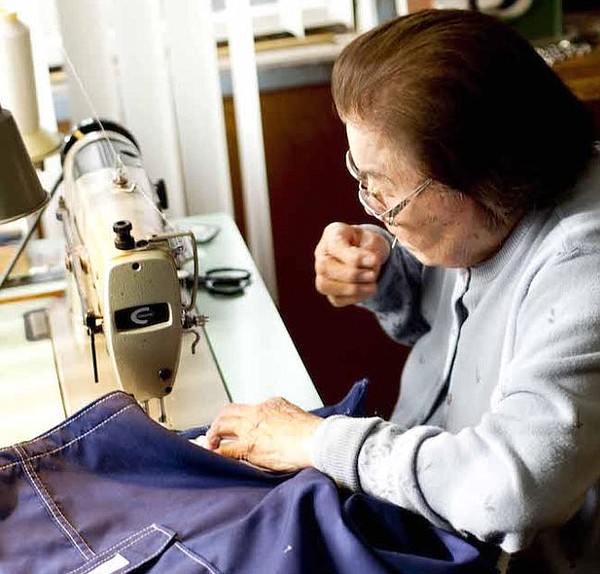 Sato Hughes sewing custom boardshorts. All photos courtesy of Katin