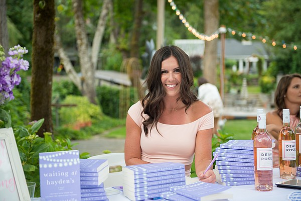 Riley Costello during a pre-launch book party held in Lake Oswego, Ore. 
Photo credit: Ryan Selewicz