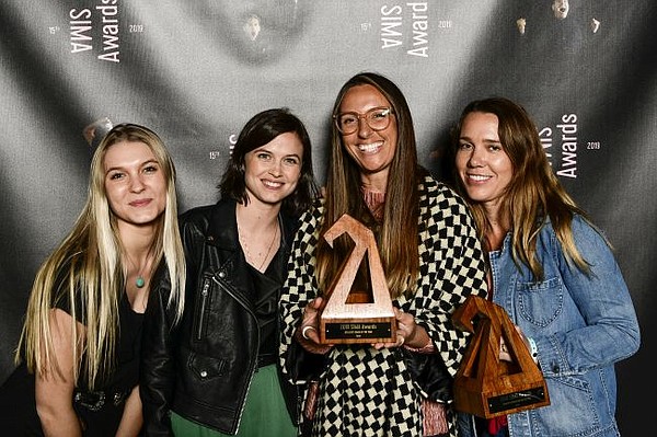 Amanda Chinchelli of Seea holds trophy at 15th Annual SIMA Awards. All images courtesy of SIMA