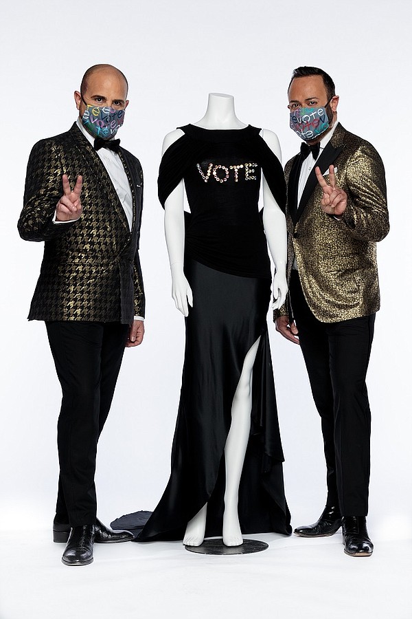 From left, FIDM Co-Chairs of Fashion Design, David Paul and Nick Verreos, with their custom Nikolaki Vote design