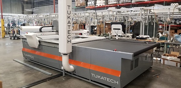 Levi’s largest supplier of knit garments, Combined Fabric, recently added a third Tukatech automatic high-ply cutter. 

Image: Tukatech