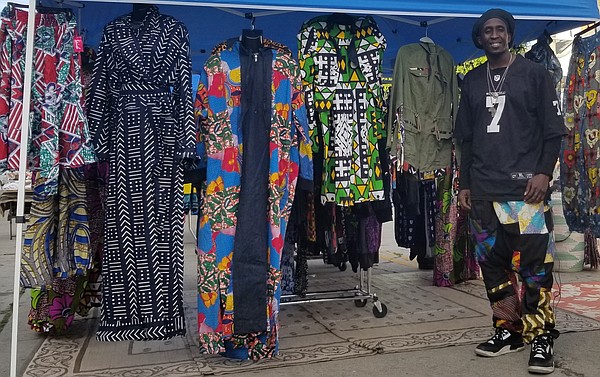 Buna Diagne of Wolofwear imports from Senegal the contemporary designs created by his wife, who uses traditional African  fabrics to create clothing. Diagne participated in the Buy Black Bazaar hosted by BAFA in Leimert Park Nov. 26.