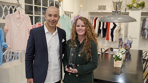 Marco Valverde, partner and apparel national practice leader at Moss Adams, with MAFI Award winner Audrey McLoghlin, CEO and founder of Frank & Eileen