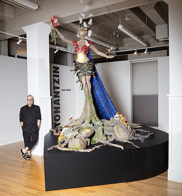 Los Angeles designer Louis Verdad stands with his sculpture, Louis Verdad: TONÁNTZIN, at LA Plaza de Cultura y Artes in downtown Los Angeles. | Photo  by Rodney Ray