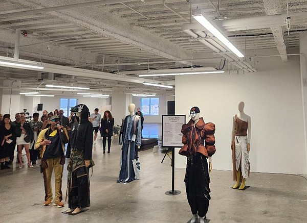Manny Jackson of Thread Haus Co (pictured left foreground) announces “Nature’s Algorithm” by David Parong of ASU FIDM as the winner of Nexus Moda’s student upcycling competition.